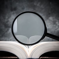 magnifying glass on the book