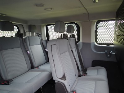 2015-2016 Ford Transit Window Van (Wagon) with low roof, standard length 130 inch wheel base and dual swing out doors on passenger side